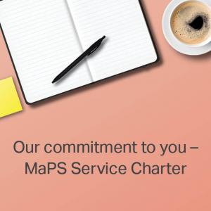 Image of desk with text saying Our commitment to you - MaPS Service Charter